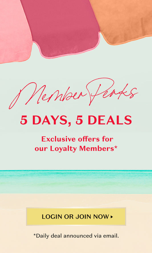 Beach umbrella in pink, magenta, and orange at the top. Large script text says 'Member Perks'. Bold text below reads '5 DAYS, 5 DEALS'. Subtext: 'Exclusive offers for our loyalty members'. Yellow button at the bottom center says 'LOGIN OR JOIN NOW'. Small text underneath: '*Daily deals announced via email'. Background features ocean waves and sandy beach.