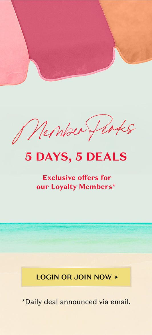 Beach umbrella in pink, magenta, and orange at the top. Large script text says 'Member Perks'. Bold text below reads '5 DAYS, 5 DEALS'. Subtext: 'Exclusive offers for our loyalty members'. Yellow button at the bottom center says 'LOGIN OR JOIN NOW'. Small text underneath: '*Daily deals announced via email'. Background features ocean waves and sandy beach.