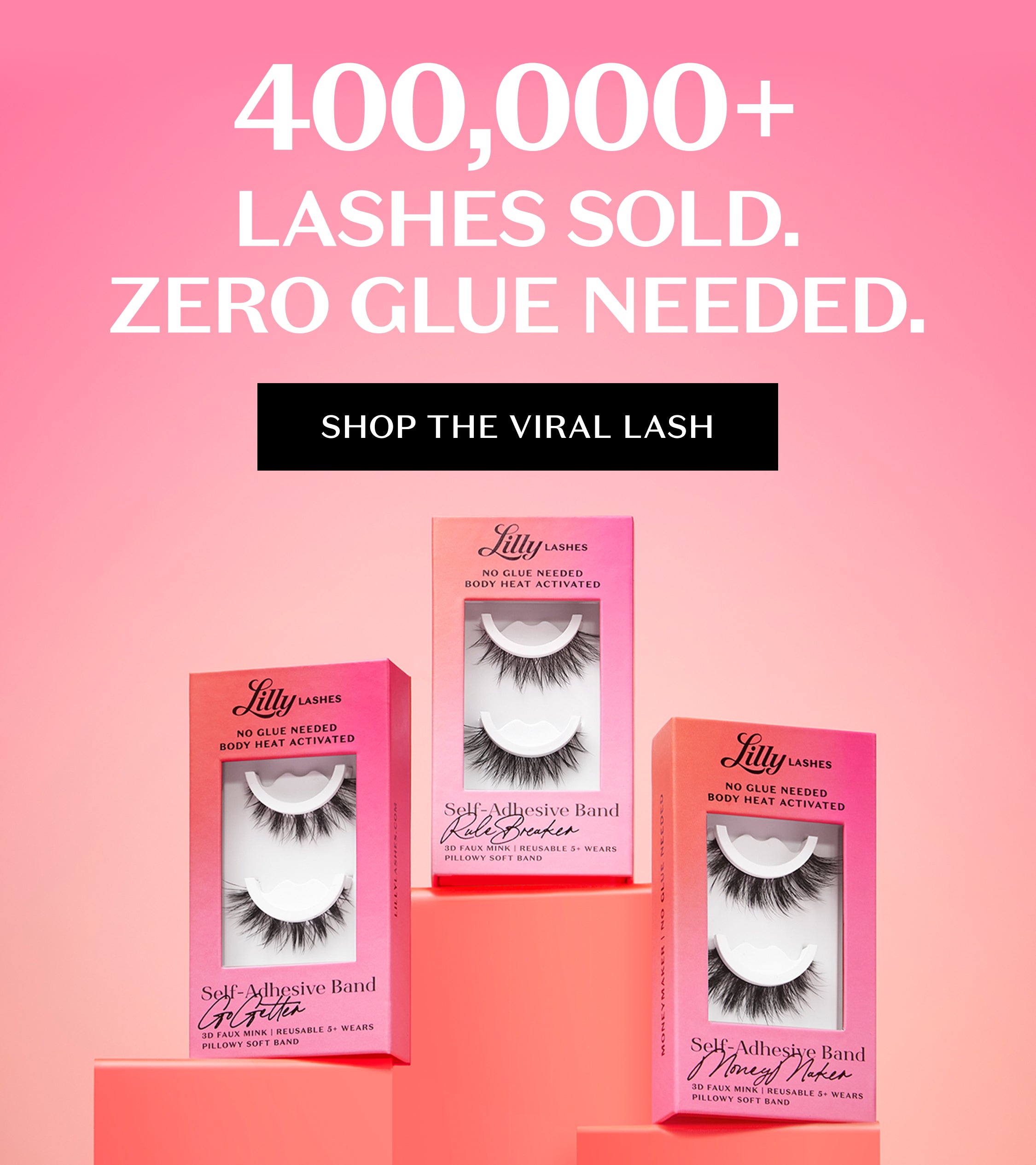 Pink gradient background with bold white text reading ‘400,000+ Lashes Sold. Zero Glue Needed.’ Black button below says ‘Shop the Viral Lash.’ Three Lilly Lashes Self-Adhesive Band lash boxes displayed on pink podiums, featuring styles ‘Godiva,’ ‘Lash Breaker,’ and ‘Money Maker.